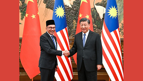 Xi meets Malaysian PM