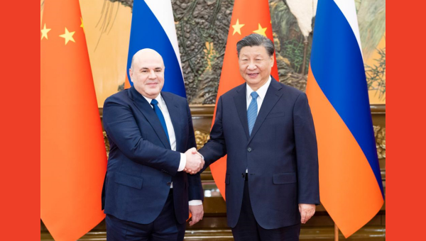 Xi meets with Russian PM