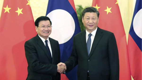 Xi calls for closer exchanges with Laos