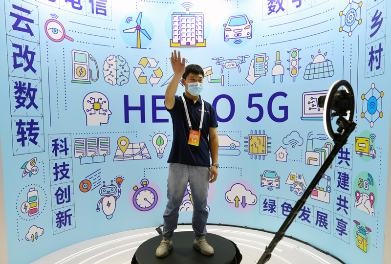 An exhibitor demonstrates 5G-powered 360-degree photography