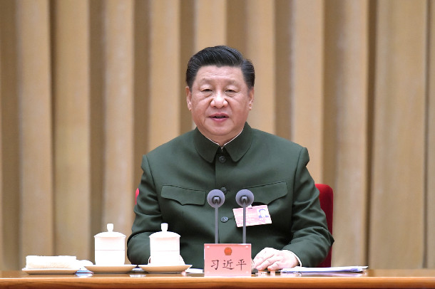 Xi stresses running military in accordance with law