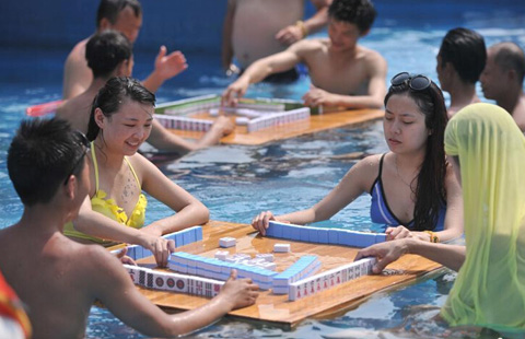 Beating the heat with mahjong, water fights and massage