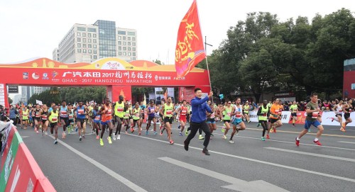 Runners set off at the start of the GHAC 2017 Hangzhou Marathon in Hangzhou, Zhejiang province.jpg