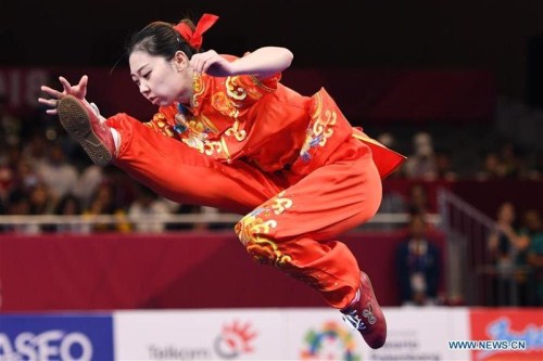 Qi Xinyi from Fuyang district of Hangzhou, Zhejiang province, competes during the women's Changquan final at the 18th Asian Games in Jakarta, Indonesia, Aug 22..jpg