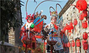 Festive parade adds luster to ancient town
