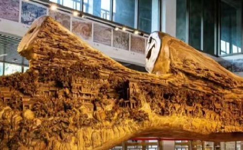 Craftsman plans giant wood carving featuring canal