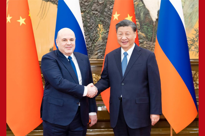 Xi meets with Russian PM