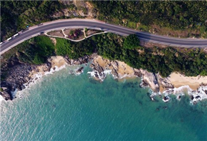 Aerial view of seaside sightseeing highway in Wanning, S China
