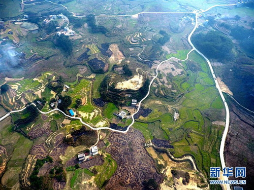 Farmers furrow Hechi fields