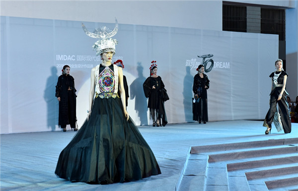 Models walk on the stage to demonstrate the design works of IMNU’s graduates.jpg