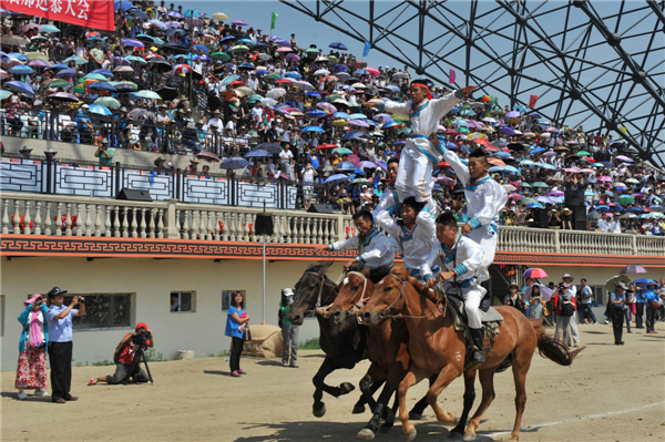 Horse riders gallop into the opening ceremony of the 24th Tourism Naadam Festival 