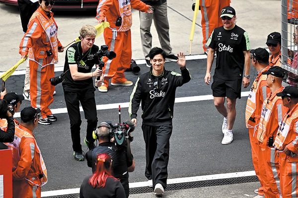 From audience to race driver, China's 1st F1 star Zhou Guanyu shines at home