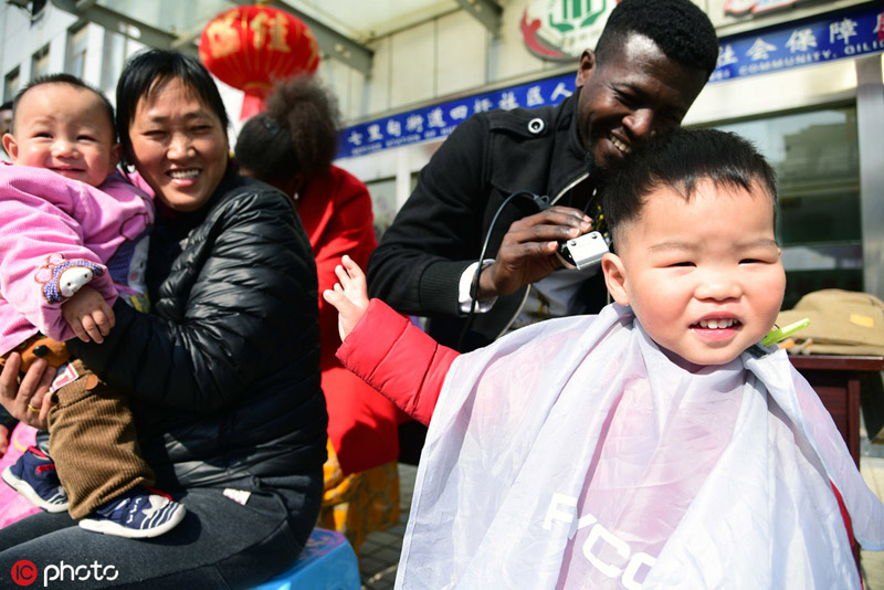 Foreign Barbers Give Haircuts For Longtaitou Festival