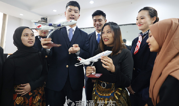Intl students learn to be qualified flight attendants