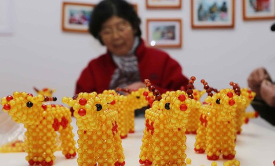 Colorful beads threaded into New Year wishes