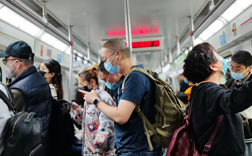 China ends mandatory face masks on public transport
