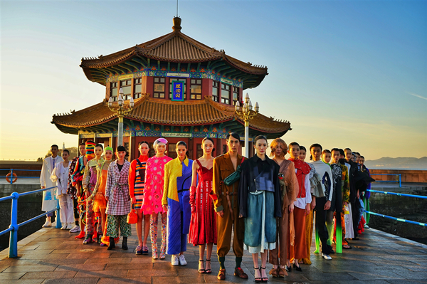 Fashion designs showcased on ancient trestle