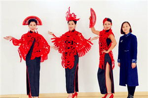 Traditional paper-cutting adds festive touch to qipao