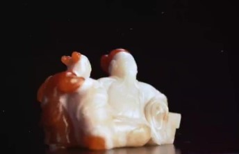 Red and White Agate sculpture depicting Chinese poet Li Bai