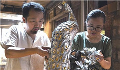 Young artist couple resurrects traditional tin carving