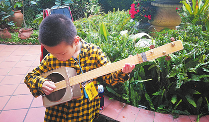 Child band hits high notes with instruments made from rubbish 