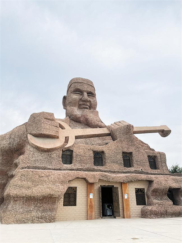 The entrance of Jiayi village, Xinjiang Uygur autonomous region.[Photo by Xing Wen China Daily].jpg
