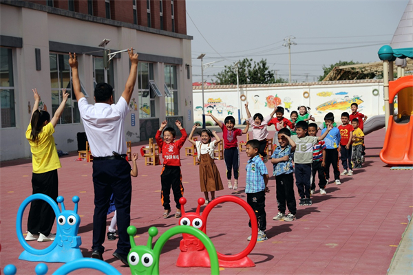 Children engage in playful activities at a kindergarten in Jinnan New Village of Qira county, Hotan. [Photo by Wang Zhuangfei chinadaily.com.cn].jpg