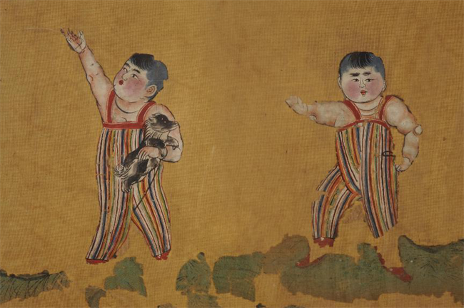 吐鲁番市阿斯塔那187号墓出土的绢画《双童图》唐代.png