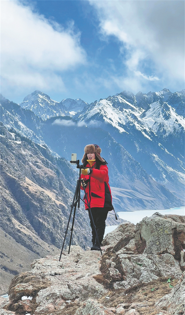 Li Yang, shown here capturing the beauty of Zhaosu county, Xinjiang, wins the title of Gold Medal Ambassador in the online influencer section of the competition. CHINA DAILY.jpg