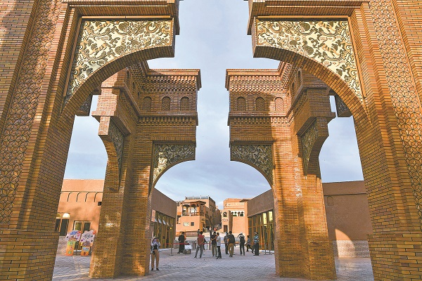 3-Tourists explore Kashgar Ancient City in June. HU HUHU XINHUA.jpg