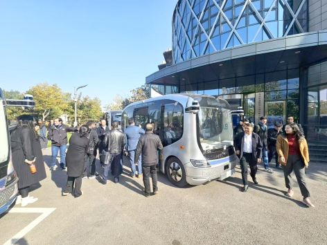 AIIB team gets hands on experience of autonomous driving in Beijing E-Town