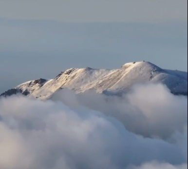 Helan Mountain shrouded in mist after snow