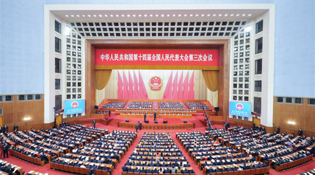 China's national legislature holds closing meeting of annual session