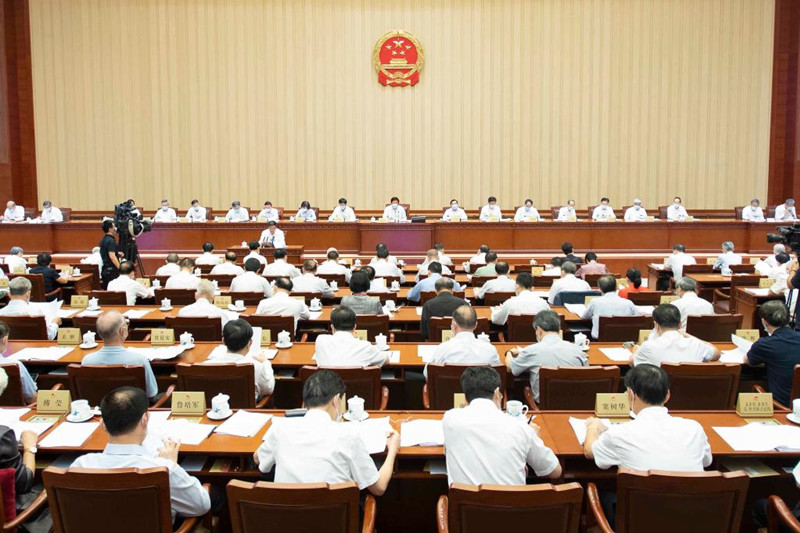 Chinese lawmakers meet to hear multiple reports.jpg