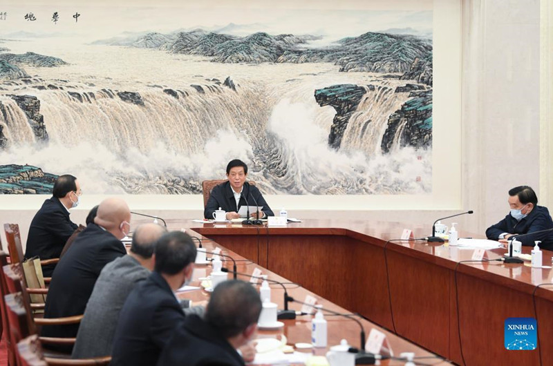 China's top legislator attends symposium with lawmakers.jpg