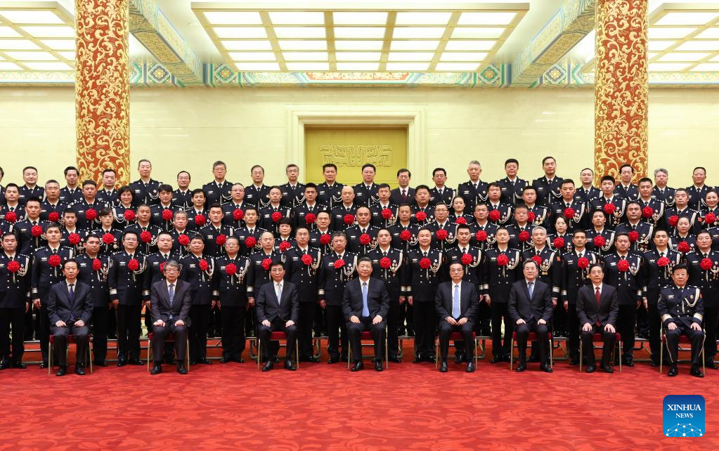 Xi meets heroes, role models from public security system2.jpg