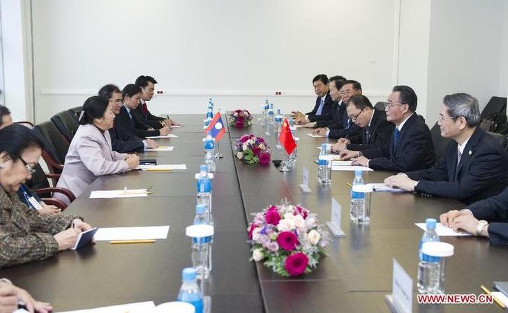 Wu Bangguo (2nd R), chairman of the Standing Committee of the National People's Congress of China, meets with Lao National Assembly President Pany Yathotu (2nd L) during the 21st annual meeting of the Asia-Pacific Parliamentary Forum (APPF) in Vladivostok, Russia, Jan. 29, 2013.(Xinhua/Wang Ye)