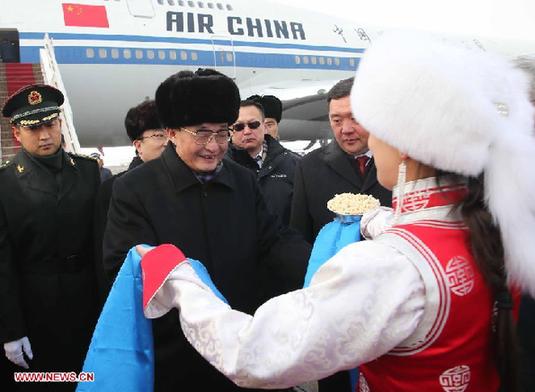 Wu Bangguo, chairman of the Standing Committee of the National People's Congress of China, is welcomed upon his arrival in Ulan Bator, Mongolia, Jan. 30, 2013. (Xinhua/Liu Weibing) 