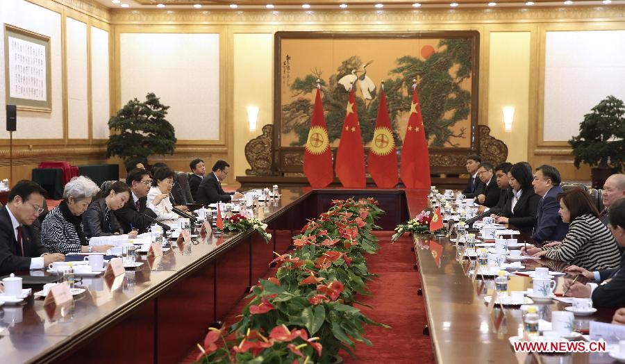 Zhang Dejiang (4th L), chairman of China's National People's Congress (NPC) Standing Committee, holds talks with the Speaker of Kyrgyzstan's Parliament Asylbek Zheenbekov in Beijing, capital of China, May 6, 2014. (Xinhua/Pang Xinglei) 