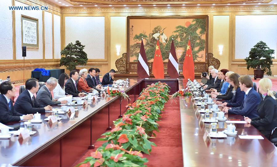 Zhang Dejiang (5th L), chairman of China's National People's Congress (NPC) Standing Committee, holds talks with Solvita Aboltina (5th R), chairperson of the Parliament of Latvia, in Beijing, capital of China, May 27, 2014. (Xinhua/Li Tao) 