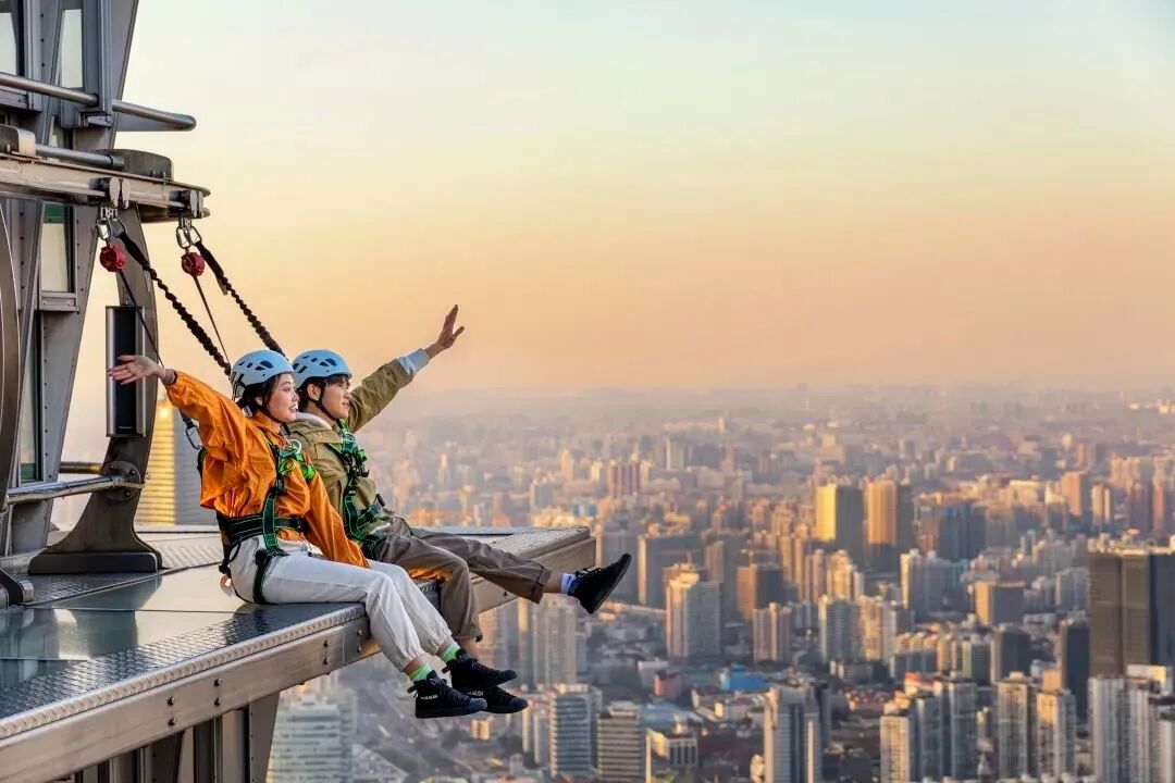 Visitors enjoy the view from the observation deck on the 88th floor at Jingmao Tower..jpg